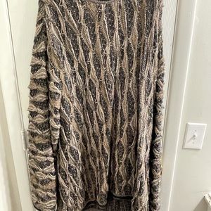 I am selling a Coogi sweater never worn dry cleaned.